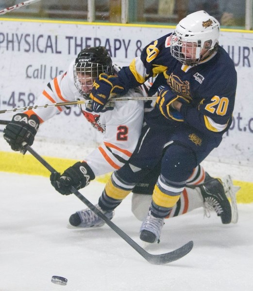 STICK WORK &#8211; Jason Miller of the St. Albert Raiders tangles with James Hilsendager of the Lloyminster Bobcats in Saturday&#8217;s midget AAA game at Akinsdale Arena.