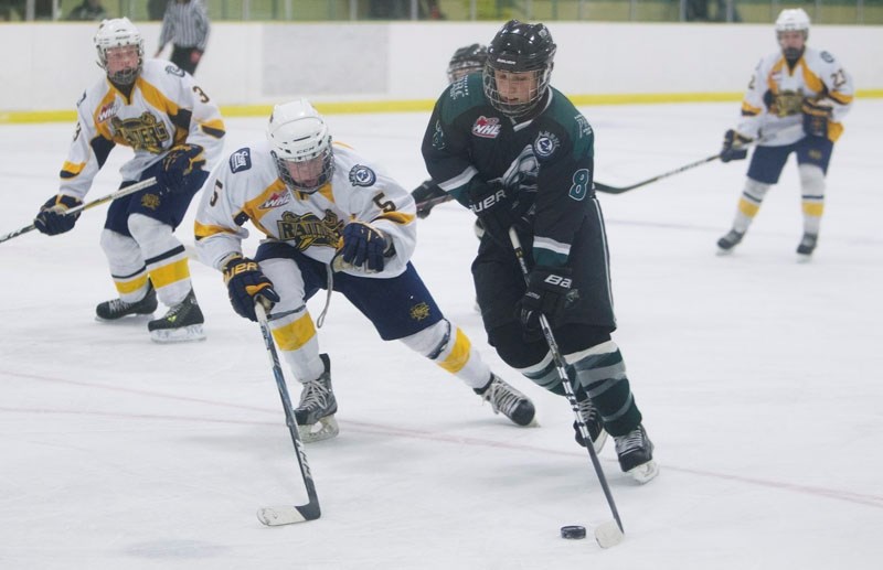 SABRES RATTLE SAINTS &#8211; Connor Deighton of the St. Albert Sabres defends against Colin Schmidt of the Spruce Grove Saints in Saturday&#8217;s bantam AAA game at