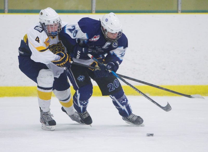 CAPTAINS CLASH &#8211; St. Albert Sabres captain Josh Mahura ties up his counterpart on the Maple Leafs