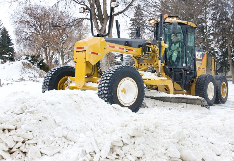 SNOW CLEARING – City equipment began clearing residential streets on Friday morning. The recent cold weather has melted the accumulated snow pack