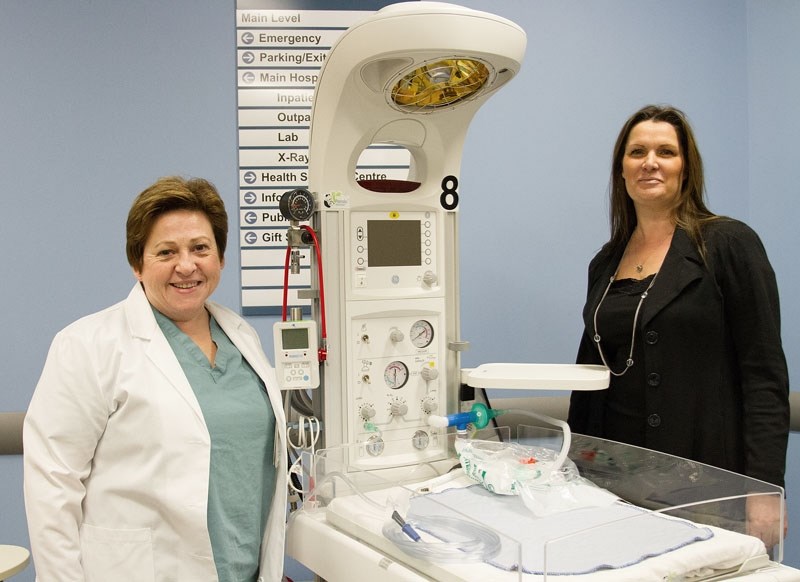 BABY MOVER – Neonatal nurse Joyce Russell (left) and Katrina Black of the Sturgeon Community Hospital Foundation show off a new neonatal transport unit they received thanks