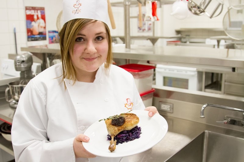 ORDER UP – Bellerose student Cassidy Wilson displays a plated dish of bacon-braised cabbage and Brome Lake duck confit. Wilson is part of a new course that enables students