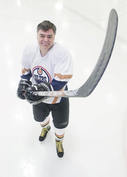 VERSATILE – Librarian and beer expert Peter Bailey shows off some of his hockey moves at the Servus Place leisure rink.