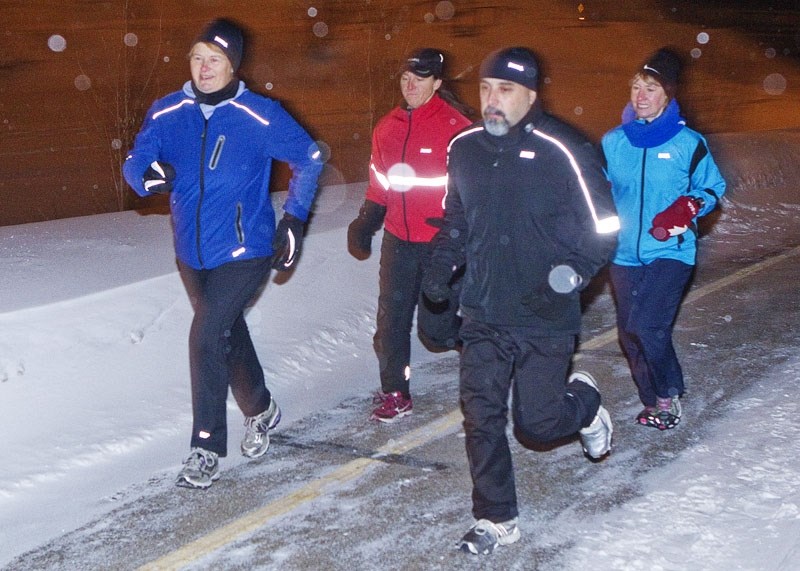 WHAT COLD? – A group of St. Albert runners sets out from the Running Room Wednesday evening