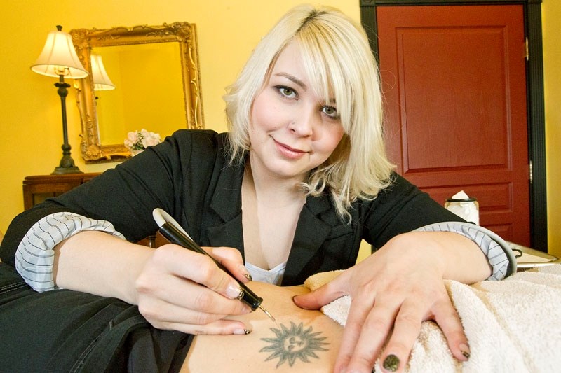 REVERSE INK – Patricia Power from External Affairs Clinical Spa uses electrocautery to remove small tattoos.