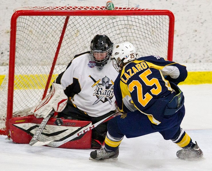 SHOWDOWN &#8211; Ethan Lazaro of the St. Albert Flyers is stymied by Lloydminster Rage netminder Dakota Kenyon in Sunday&#8217;s Alberta Minor Midget AAA Hockey League game