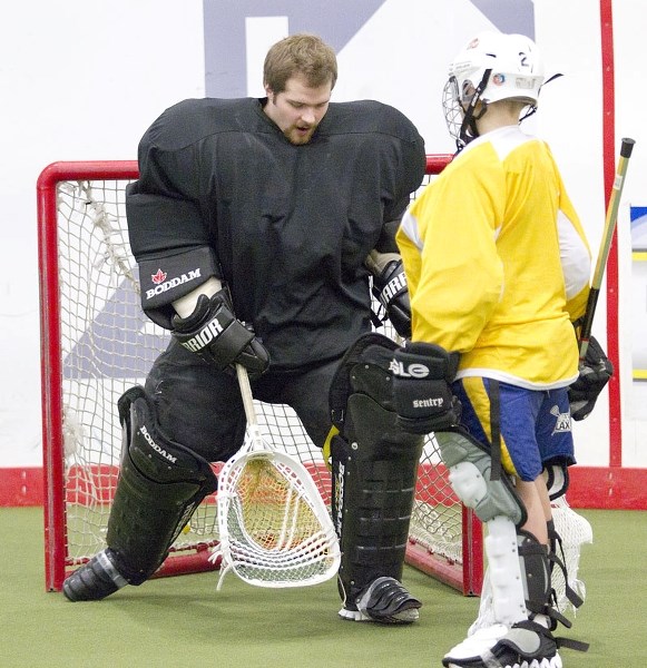 NET GUARDIAN &#8211; Sherwood Park Titans netminder Lucas Frost gives pointers to 10-year-old Jace Lesank at the second annual St. Albert Rams goalie camp on Saturday at