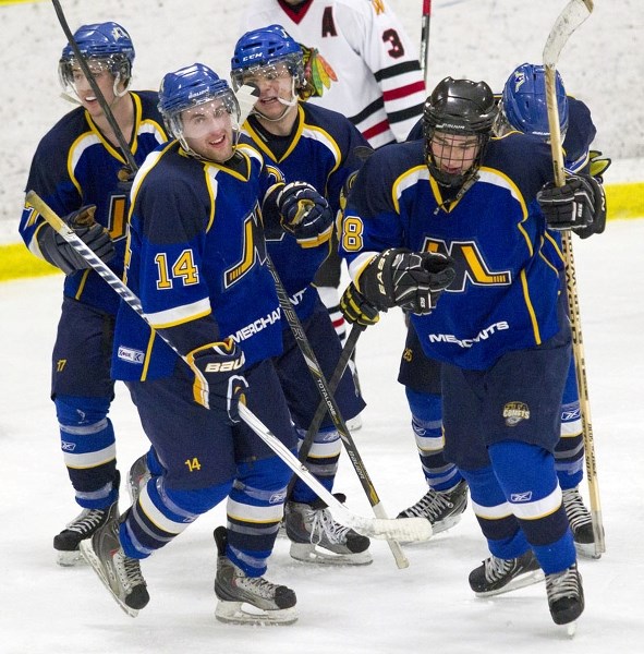 MONEY MEN &#8211; The St. Albert Merchants celebrate a goal against the Beverly Warriors in playoff action at Akinsdale Arena. The Merchants lead the best-of-five