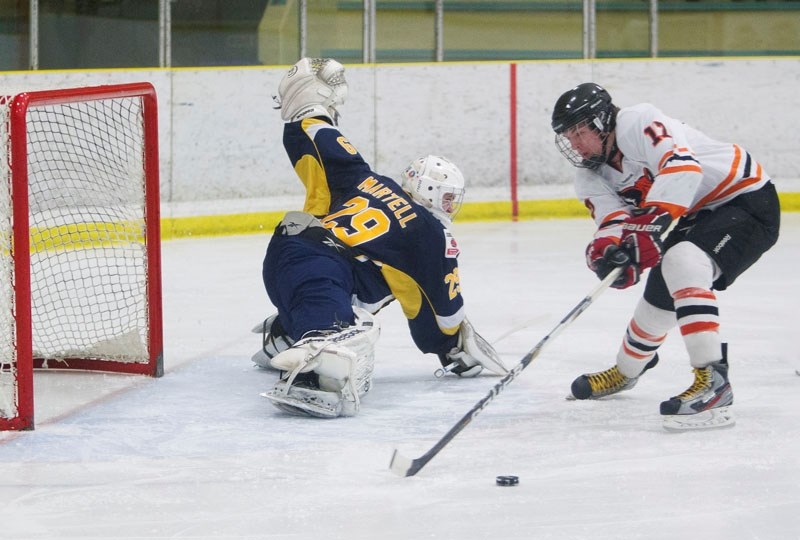PLAYOFF SAVIOUR &#8211; St. Albert Raiders netminder Mitch Martell stretches out to make the save against Trevor Ballas of the Lloydminster Bobcats in game one in the