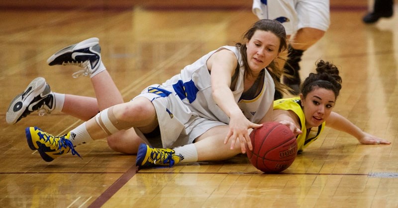 PLAYOFF BATTLE &#8211; Kayla Ivicak of the St. Albert Skyhawks wrestles an opponent for the ball in the metro Edmonton premier conference final Saturday at O&#8217;Leary High 