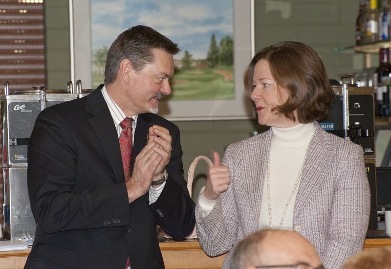 BUDGET TALK – Alberta Finance Minister Doug Horner confers with Premier Alison Redford after giving a talk on the recent provincial budget at the Sturgeon Valley Golf and