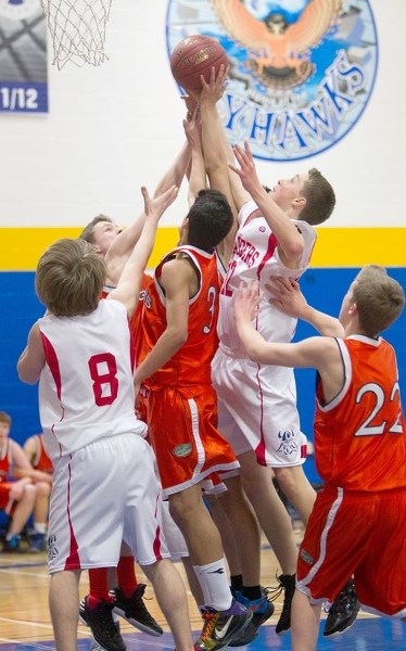 CENTRE OF ATTENTION &#8211; Naiem Qadiri (3) of the Lorne Akins Gators and Aidan Mueller of the Vincent J. Maloney Marauders stretch for the ball in a group of players in the 