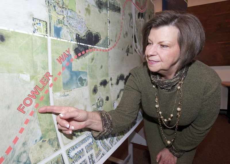 STREETS HAVE A NAME — Dawne Fowler examines a map showing the future route of Fowler Way