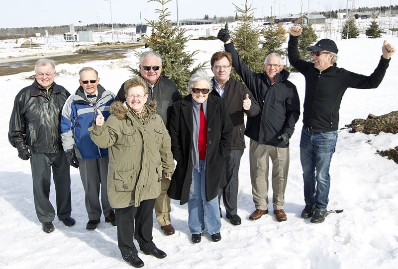 THUMBS UP – Members of the Rotary Club of St. Albert – Saint City display their enthusiasm for a park that will be completed in the Riel area this summer. The $400