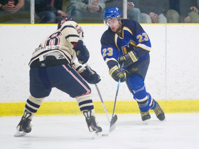 ONE-ON-ONE &#8211; Dan Rombough of the St. Albert Merchants tries to slip the puck past Dylan Weaver of the Wetaskiwin Icemen in the Capital Junior B Hockey League