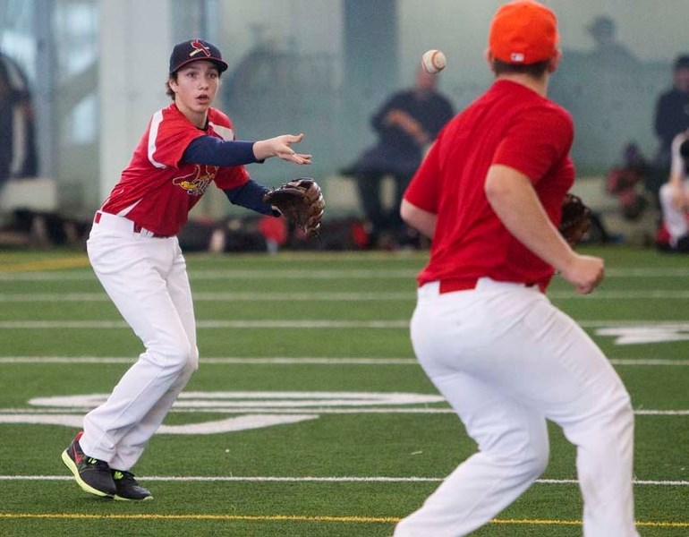 INDOOR PRACTICE &#8211; The bantam AAA St. Albert Cardinals execute a pitcher&#8217;s fielding play at Saturday&#8217;s evaluation session at the Commonwealth Community
