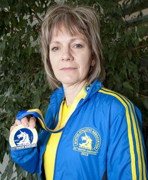 MINUTES FROM TRAGEDY &#8211; City resident Carolyn Donnelly finished the 2013 Boston Marathon last Monday about 20 minutes before two bombs detonated at the finish line.
