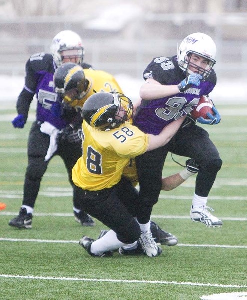 EXTRA EFFORT &#8211; Greg Fleming of the St. Albert Storm fights for yards against the Edmonton Chargers in last week&#8217;s 25-16 loss at Riel Recreation Park. The Grade 11 