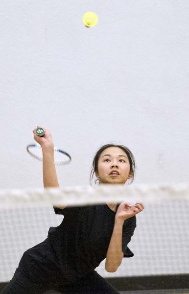 LOOKING TO STRIKE &#8211; Kylie Kwok of the ESSMY Leopards eyes up the birdie in the SAPEC junior high badminton playoffs. In the Grade 9 division