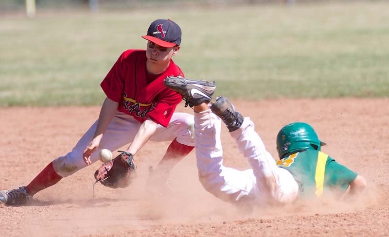 SPLIT SECOND &#8211; A Sherwood Park player just beats out the throw to Jeremy Gamracy of the St. Albert Cardinals at second base in Sunday&#8217;s bantam AAA exhibition