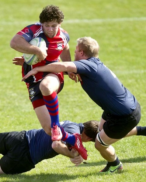 STOP ME IF YOU CAN &#8211; A determined Adam Bontus of St. Albert hurdles a defender while breaking a tackle in the second half of Saturday&#8217;s 29-22 loss to the Clansmen 