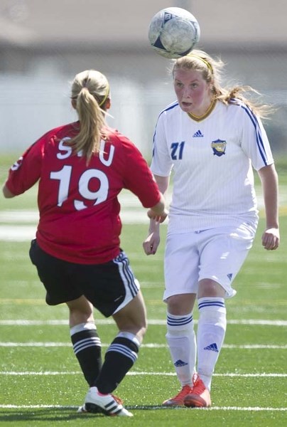 HEAD FIRST – Olivia Orman #21 heads the ball for the St. Albert Impact U18 against Calgary Saturday afternoon at Riel Turf Park.