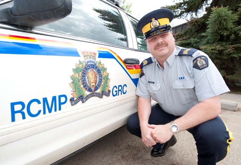TOP COP — Staff Sgt. Tom Love poses by a Morinville RCMP police car Monday. Love took over as detachment commander last week