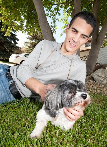 DR. DOLITTLE — Paul Kane graduate and valedictorian Nolan Chalifoux frolics with Monique
