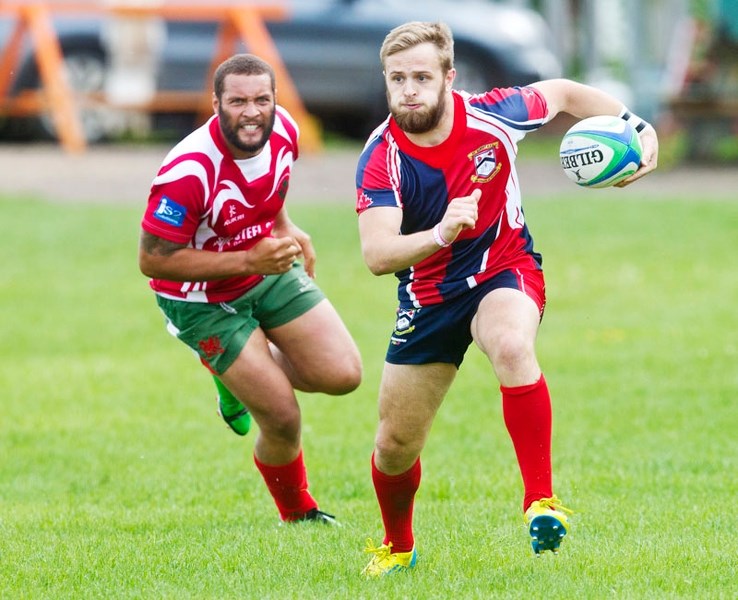 PEDAL TO THE METAL &#8211; St. Albert fullback Antony Fitch runs away from a Strathcona Druid in Saturday&#8217;s premier men&#8217;s match in Sherwood Park. St. Albert is