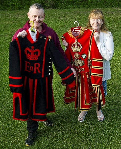 GUARD GARB – Robin and Heather Miller show off the Beefeater uniforms that Robin wore while he served at the Tower of London before the family moved to Canada.