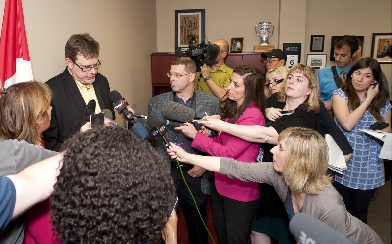 IN THE SPOTLIGHT — Edmonton-St. Albert MP Brent Rathgeber speaks to a horde of reporters at his St. Albert office Thursday about his decision to leave the Conservative