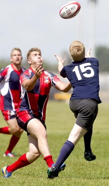 PLAYING CATCH &#8211; Billy Thomas of the St. Albert second division team challenges the Clansmen&#8217;s fullback for a fly ball in Saturday&#8217;s match at Airways Park.
