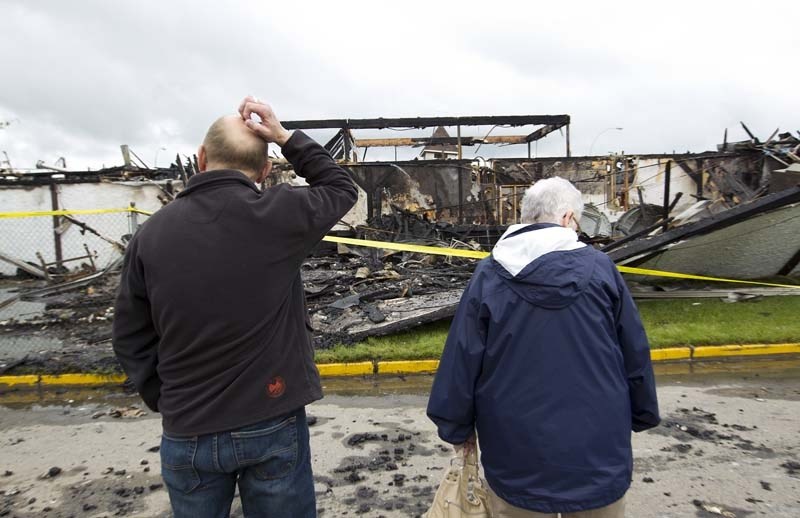 TOTAL LOSS – Tony Legge and Dora Legge take a look at the remains of St. Andrew&#8217;s Anglican Church in Morinville after it was destroyed by an early morning blaze on