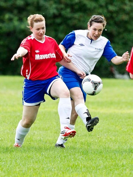 BALL CHALLENGE &#8211; Alyson Price (left) of Mavericks 09 and Rachael Redding of the Morinville Ladies get their kicks during first-half action in Sunday&#8217;s division