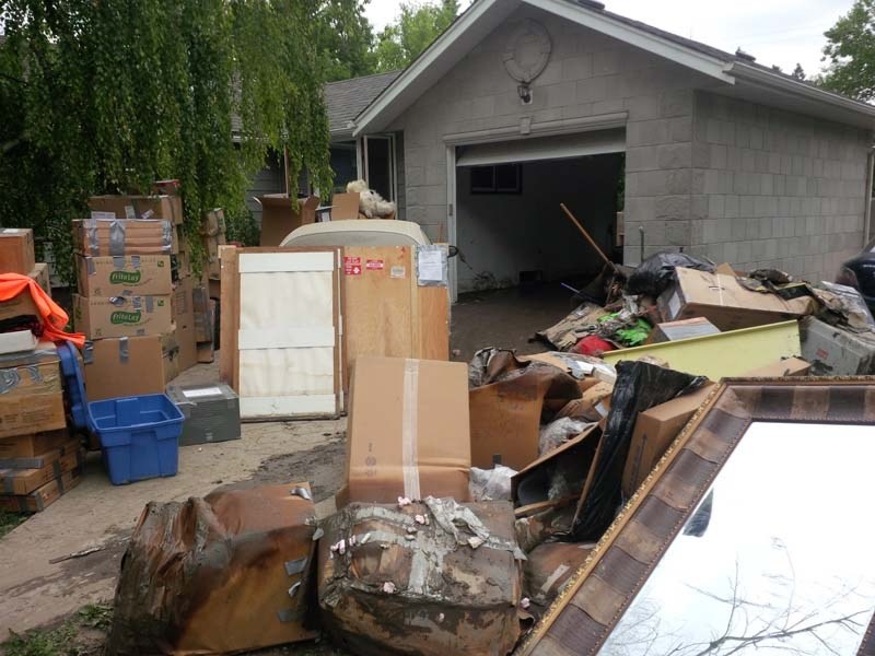 DAMAGED GOODS – Cleaning out this garage in High River