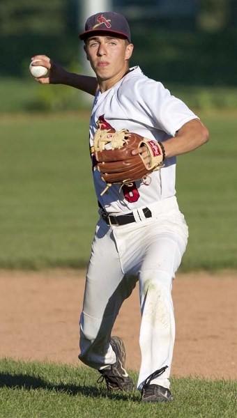 PLAY&#8217;S AT ONE – St. Albert Junior Cardinals shortstop Jarret Klim readies a throw to first for the out Wednesday evening against the Sherwood Park Athletics. The Cards