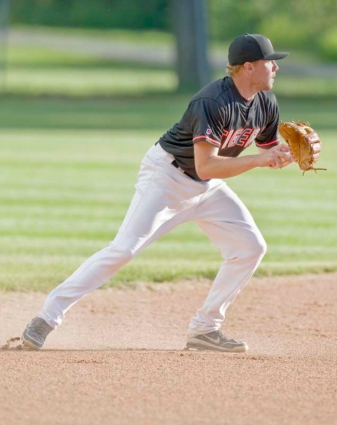 GETTING READY – St. Albert Tiger Josh Kennedy eyes his target during Sunburst League action against the visiting Parkland White Sox last Friday. The Tigers won 9-2. Both