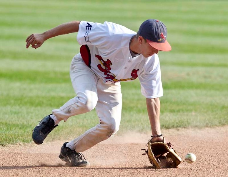 DIGGING IT – St. Albert junior Cardinals player Ian Pollard scoops up a loose ball during a game against the visiting Sturgeon Paladins on Tuesday evening.