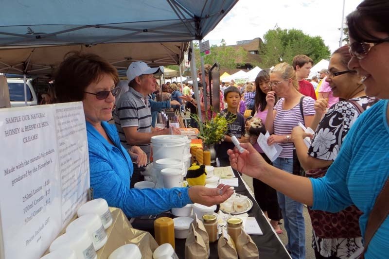 SWEET SUCCESS – Christine and Joseph Kent conduct brisk business selling honey and products derived from it at the St. Albert Farmers&#8217; Market.