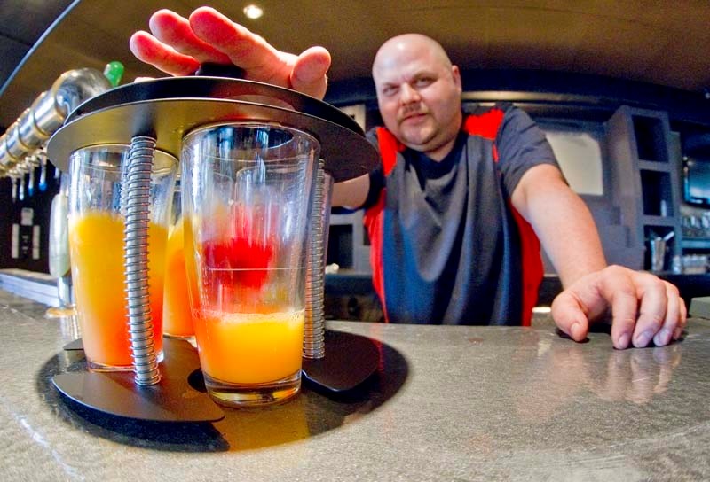 BOMBS AWAY – The Bourbon Room owner Paul Ballach shows off the Bourbon Bomber