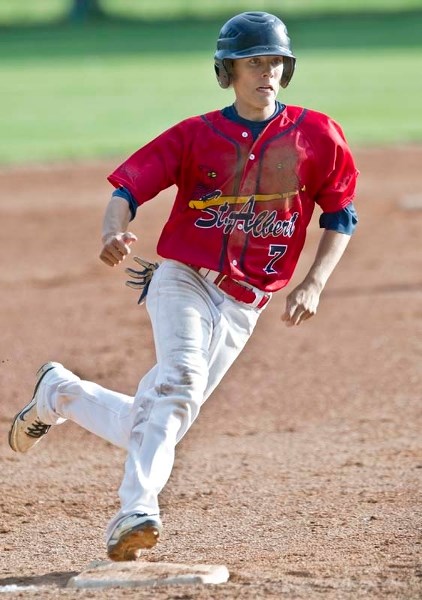 HEADING FOR HOME – Mathieu Brisson rounds third base on his way to scoring a run Wednesday evening as the midget AAA Cardinals take on SEEBA 2.