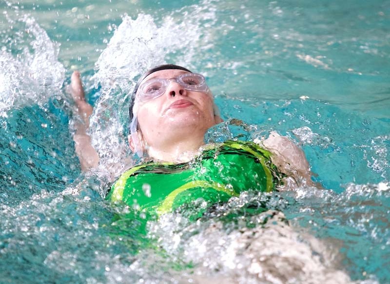 SPLASHY SWIMMER &#8211; Kaitlyn McTavish of the St. Albert Sailfish Swim Club powers her way through a backstroke race at the Alberta Summer Swimming Association region B