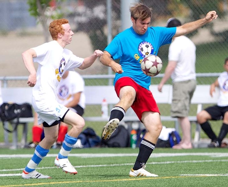 SAMSL ALL-STARS &#8211; Team Blue player Dan Hoke (SA United) attempts to gain possession of the ball while pressured by Stephen May (Blues FC) of Team White during the St.