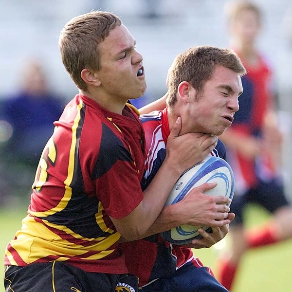 CHOKE HOLD &#8211; Hank Kieser of the St. Albert U17 rugby team is grabbed around the throat while tackled in Wednesday&#8217;s 76-7 blowout of the Nor&#8217;Westers at