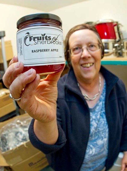 RESCUE JAM – Fruits of Sherbrooke volunteer Carol Cooper shows off a jar of jam made from fruit rescued from Edmonton backyards. The organization sells its wares at the St.