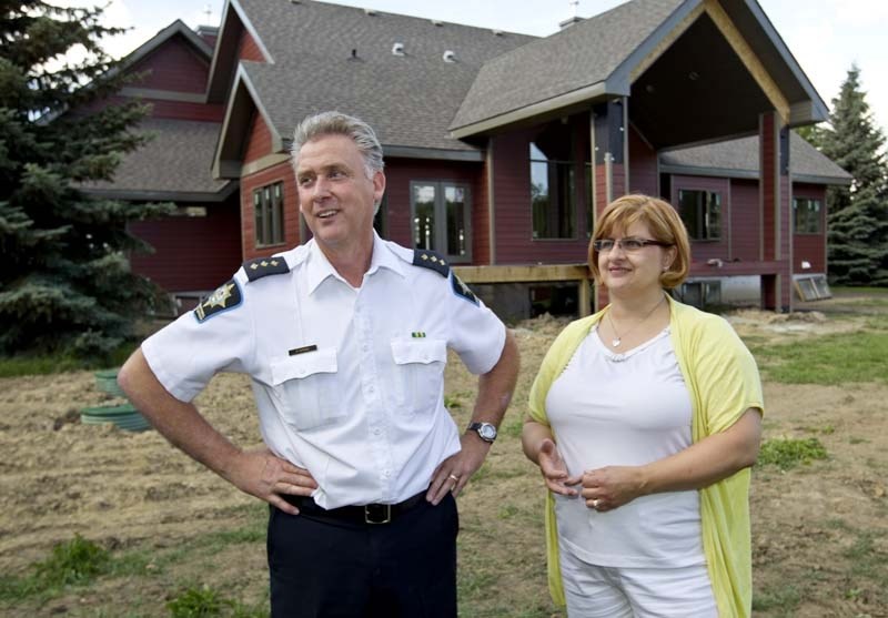 LOOKING FORWARD – Last July Sheila and Paul Tipping&#8217;s family home burnt to the ground. Just over a year later their new home is being built with an expected move-in