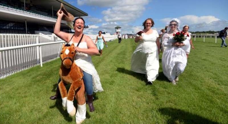 GIDDEY-YAP – Corinna Maguire from Oranmore jogs to the start of the Bridal Race in aid of the Special Olympics which was the first race at Ballybrit for the Galway Races