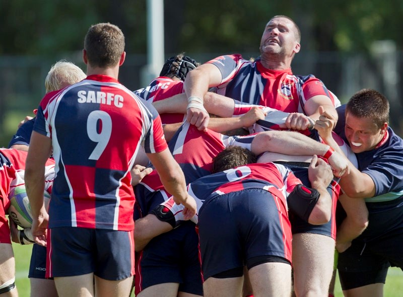SQUEEZE PLAY &#8211; Johnny Moloney is caught in the middle of a St. Albert maul against the Calgary Canucks in Saturday&#8217;s premier men&#8217;s match at Ellerslie Rugby