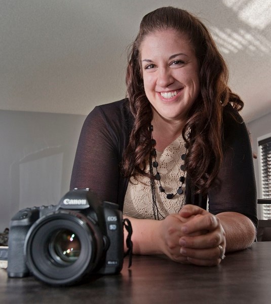 PHOTO FINISH – Tiffany Panas poses with a copy of the International Childbirth Education magazine.