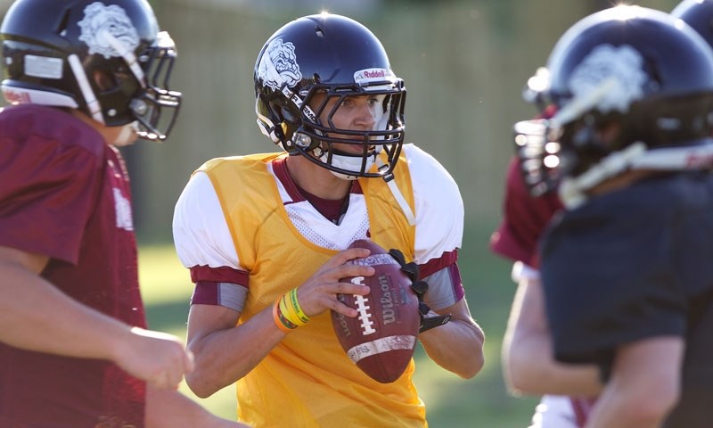PASS PLAY &#8211; Bellerose Bulldogs&#8217; quarterback Josh Dobbins looks for an open man during a drill at the senior team&#8217;s fall camp Tuesday. Next week Bellerose